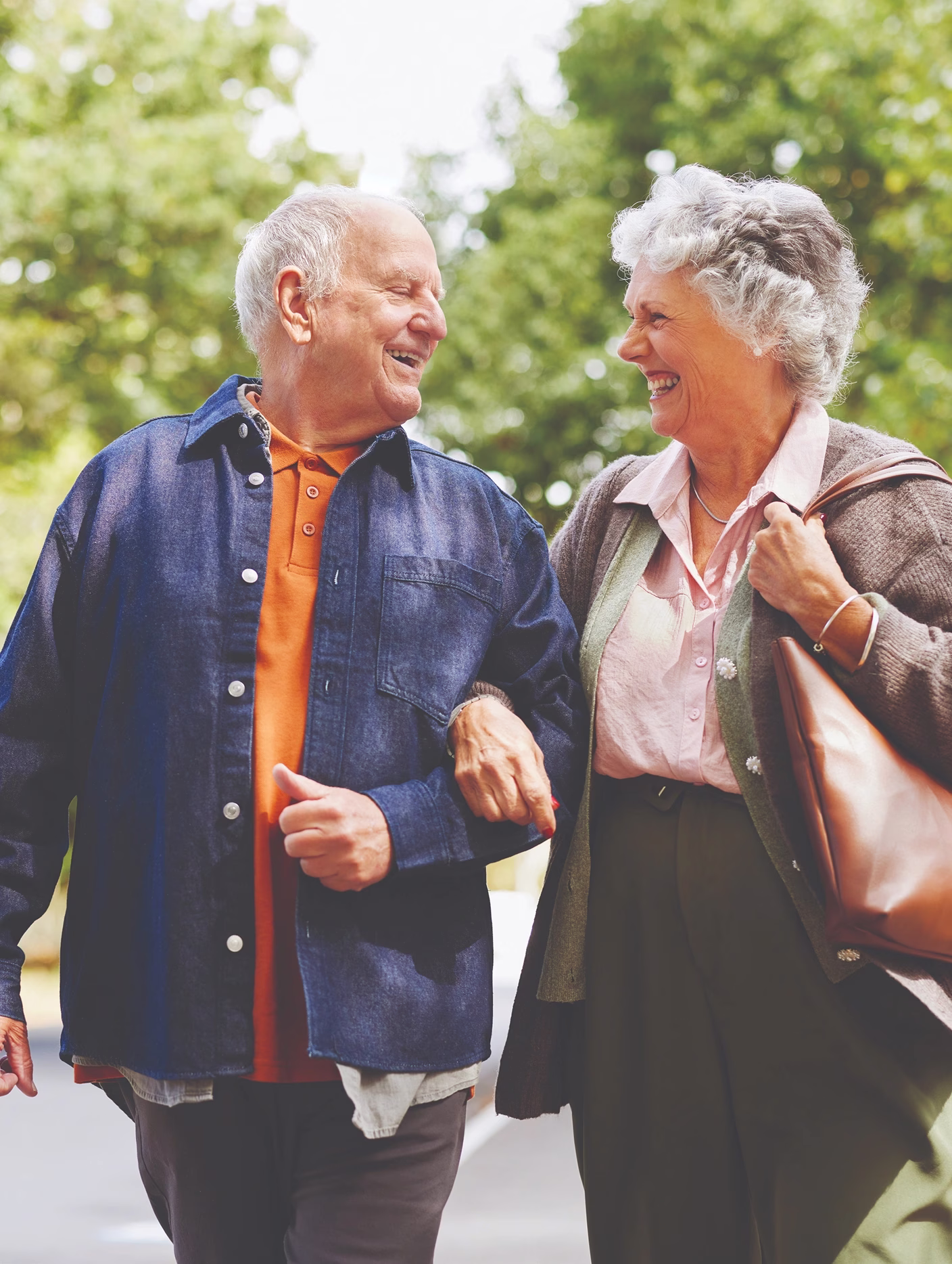 Man and woman holding hands walking