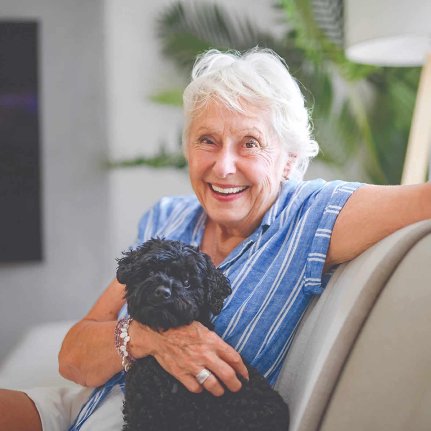 Woman and dog posing for photo