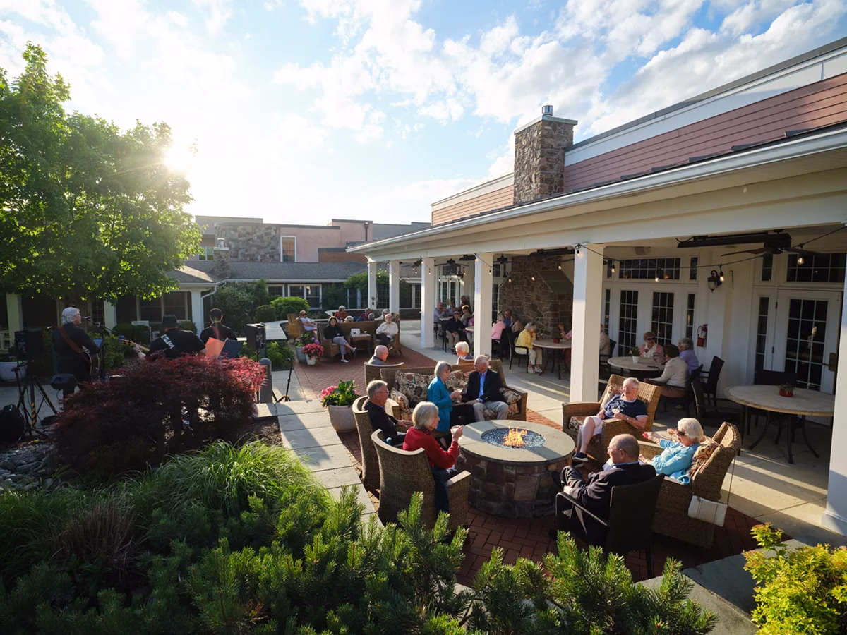 Heath Village outdoor patio filled with residents