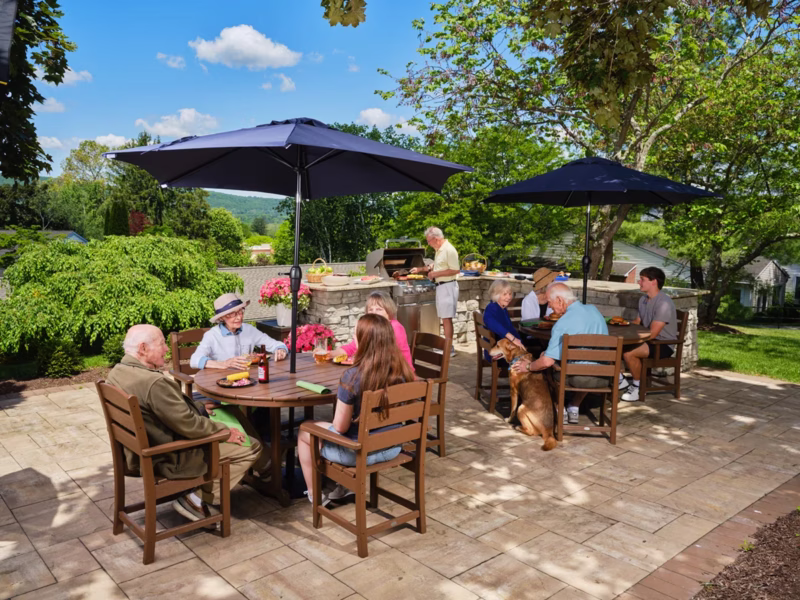 Residents and family cooking outside