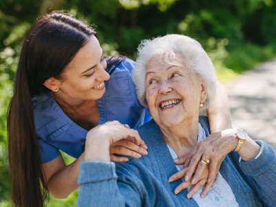 Care giver and resident outside
