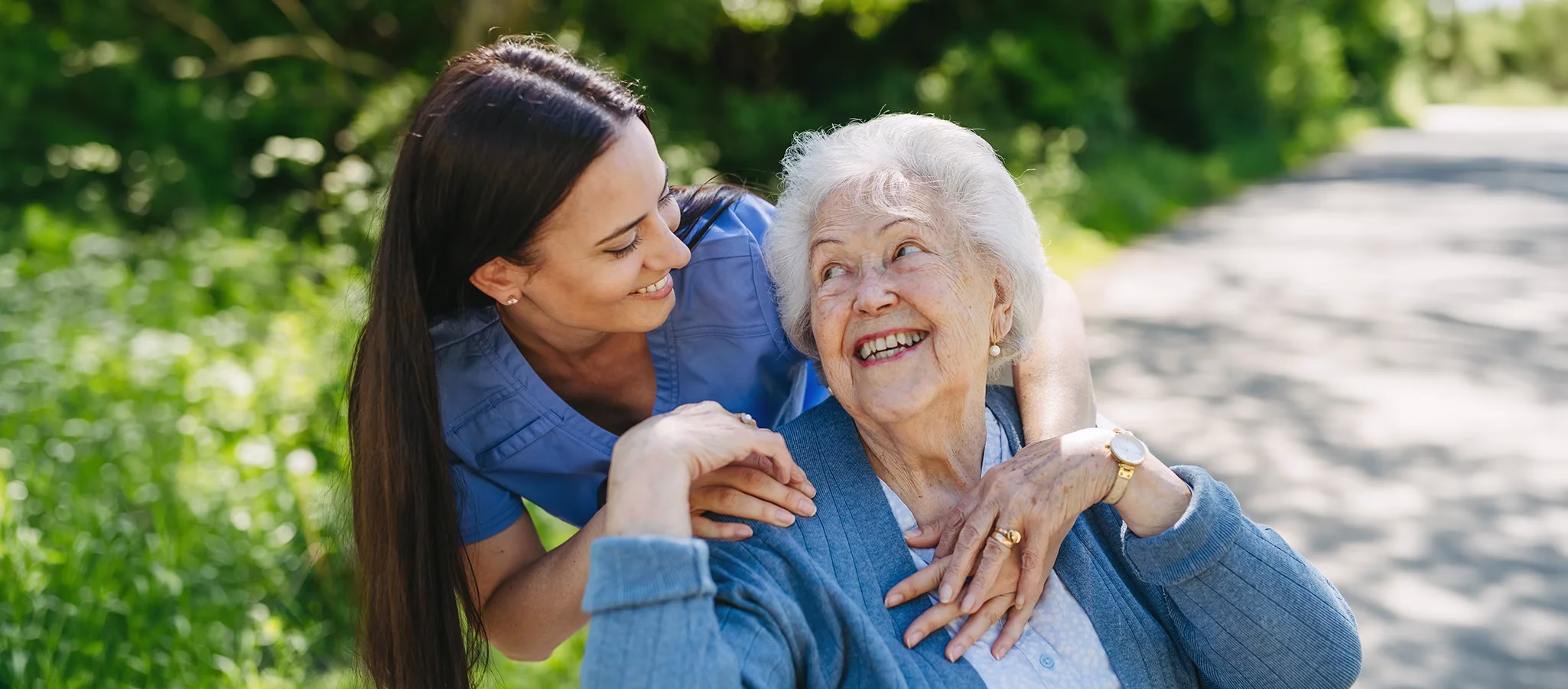 Care giver and resident outside