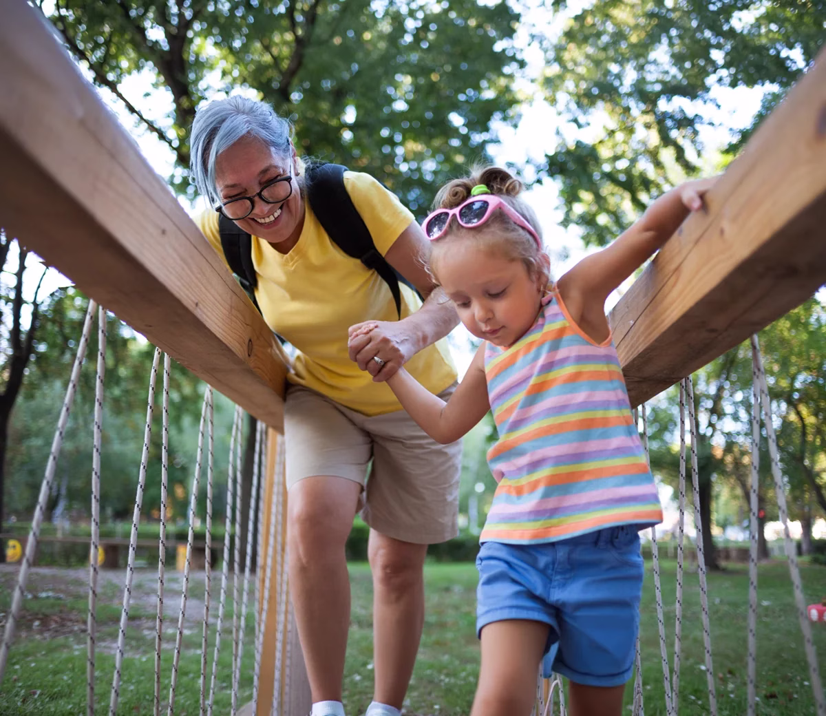 Woman and child exploring a playground