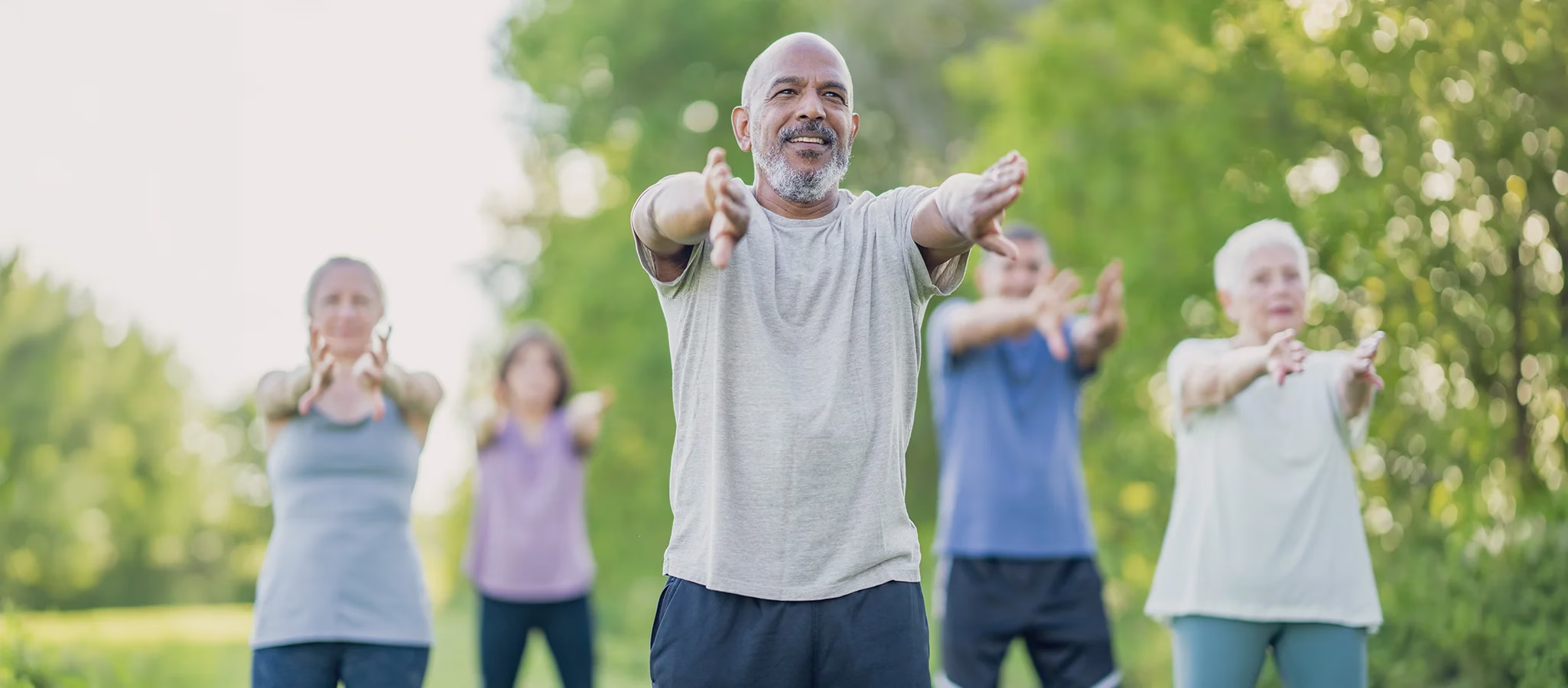 Residents engaging in yoga outside