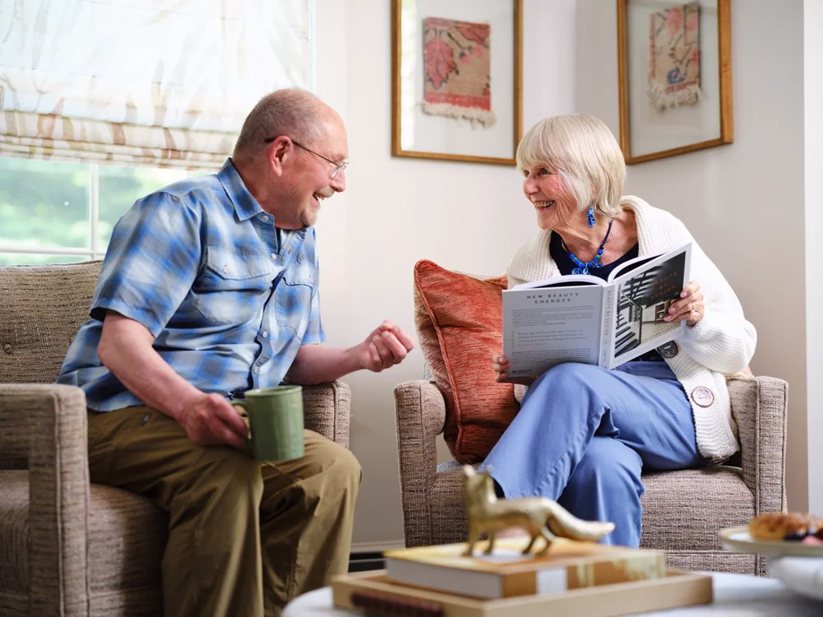 Man and woman reading and talking