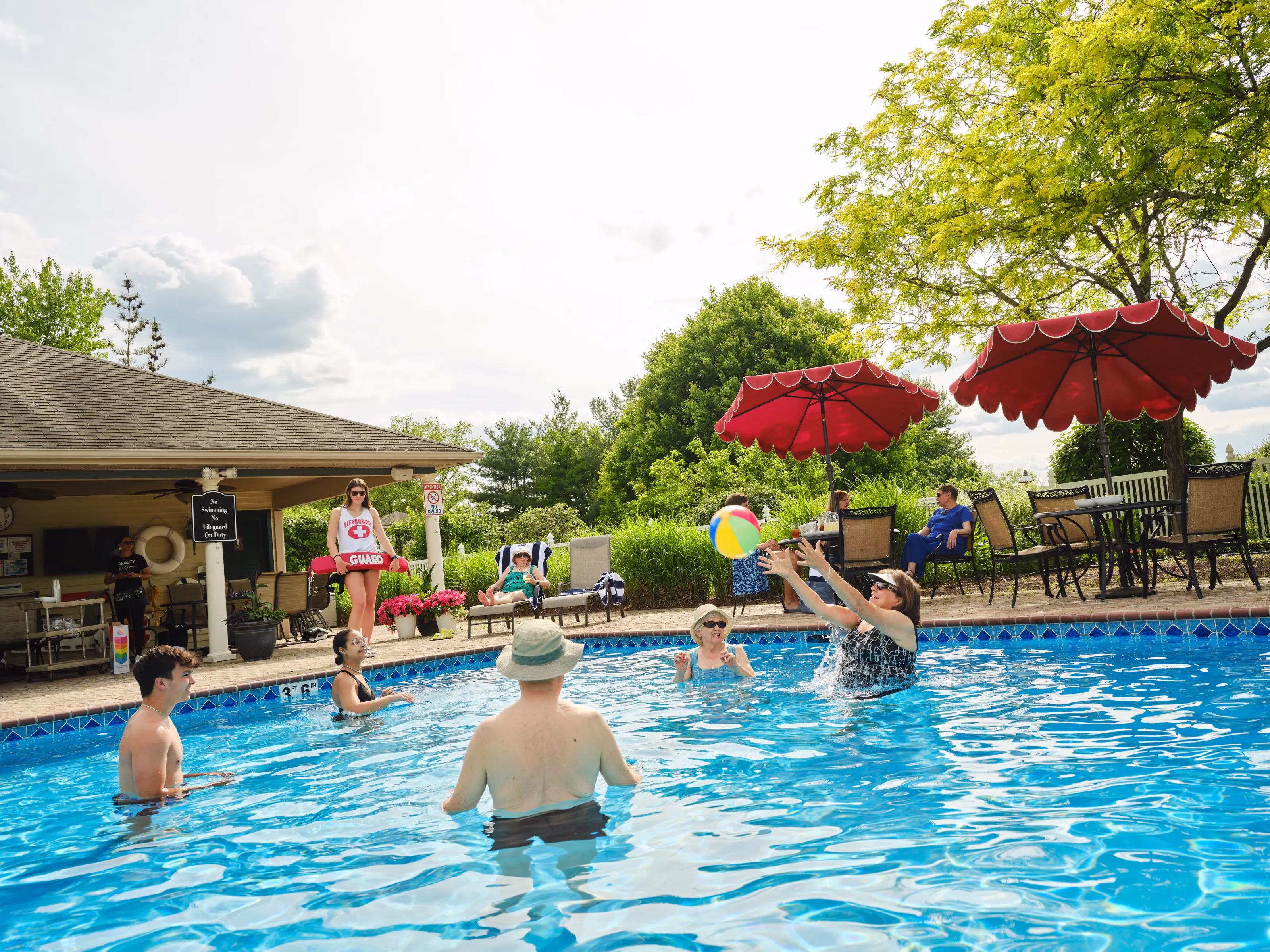 Residents and family enjoying pool