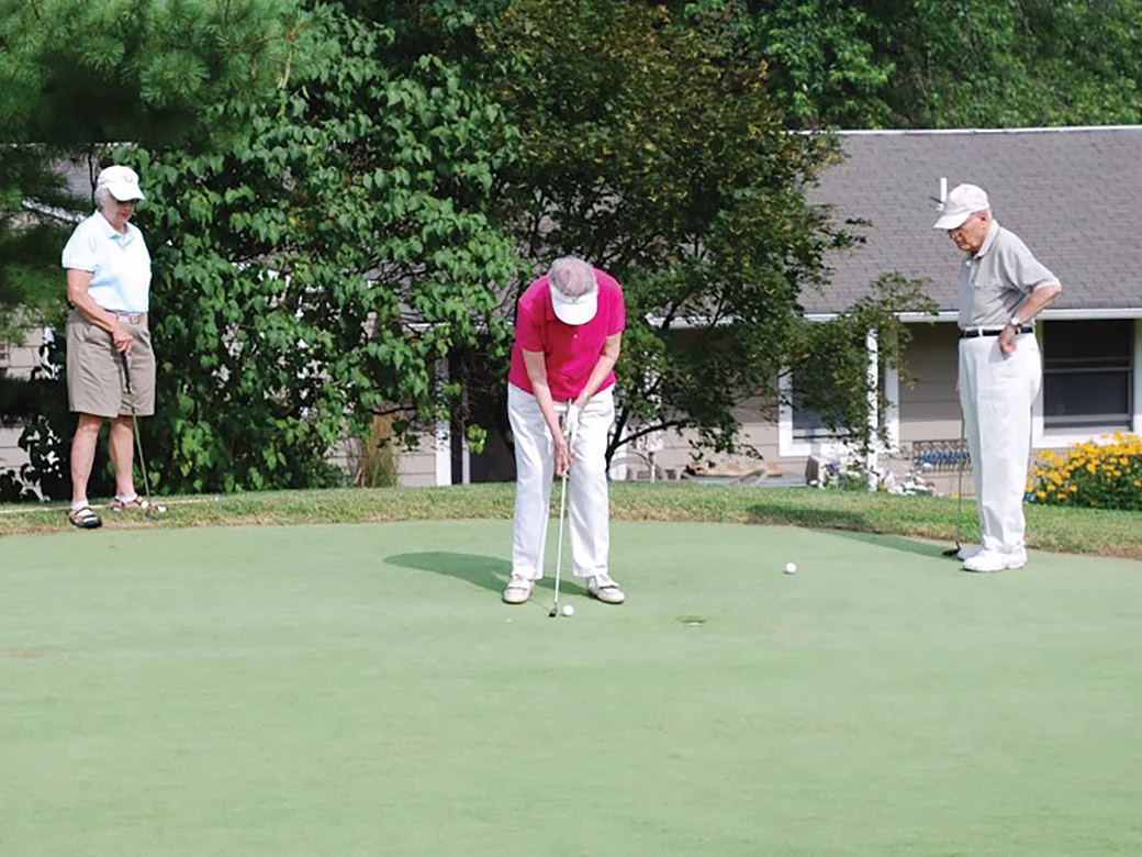 Resident putting golf ball