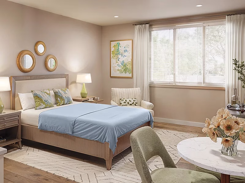 Resident room interior showing bed and table