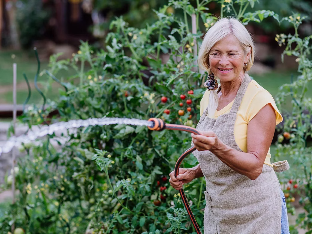 Woman watering garden
