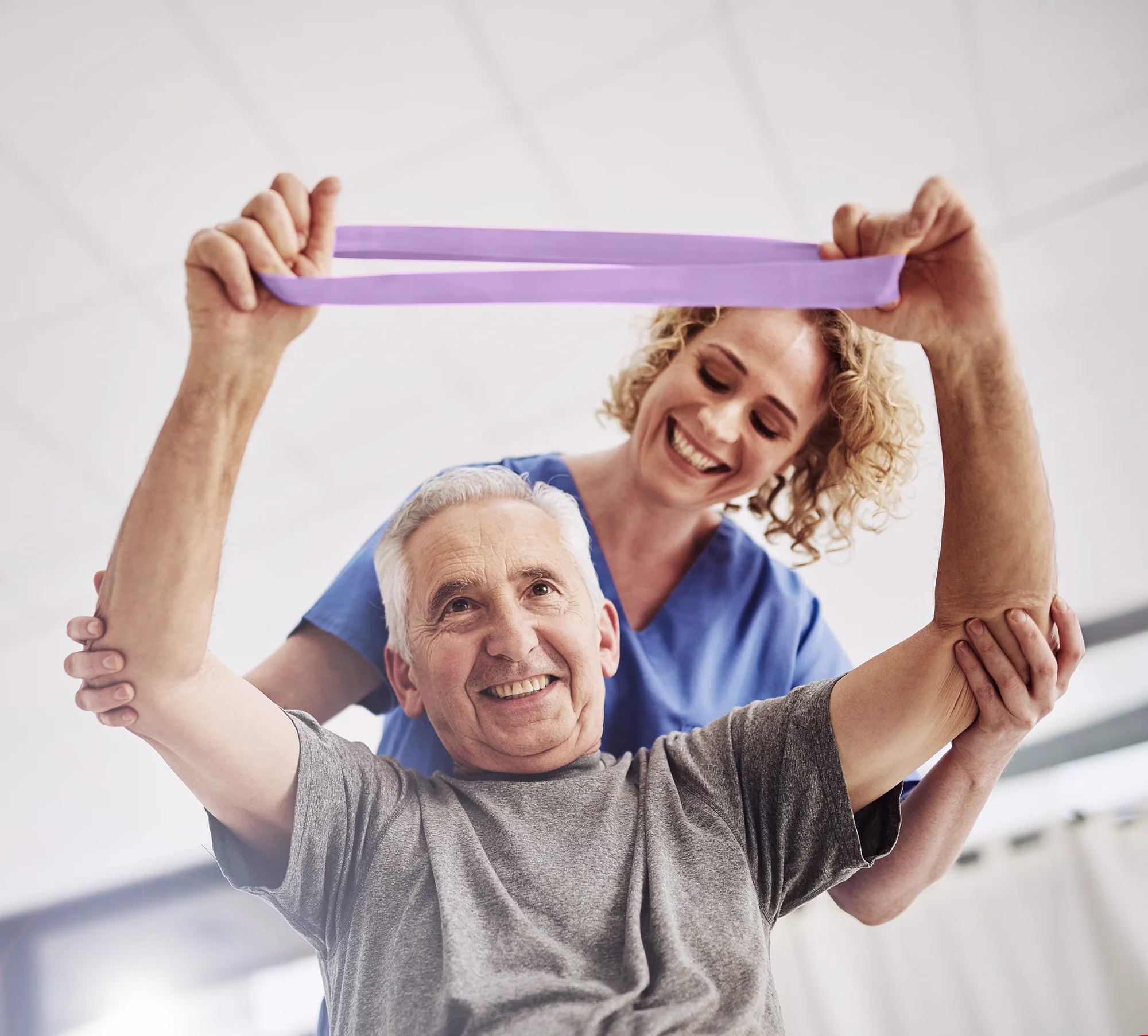 Resident and care giver engaged in physical therapy