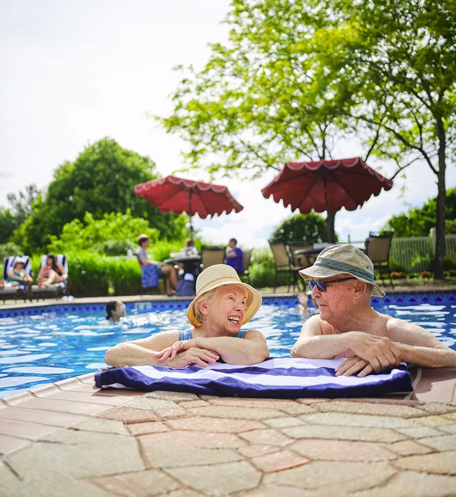 Man and woman lounging in pool