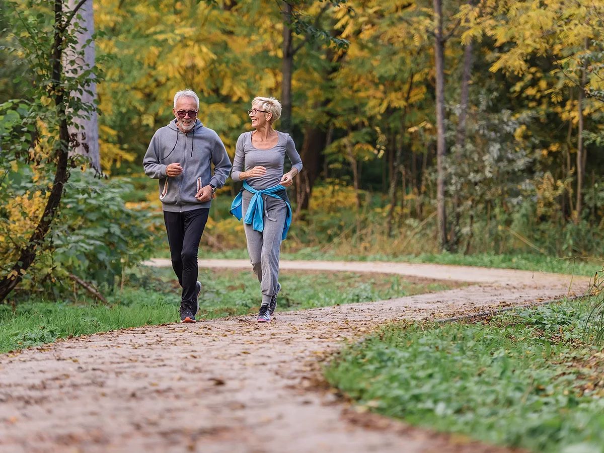 Man and woman jogging on path