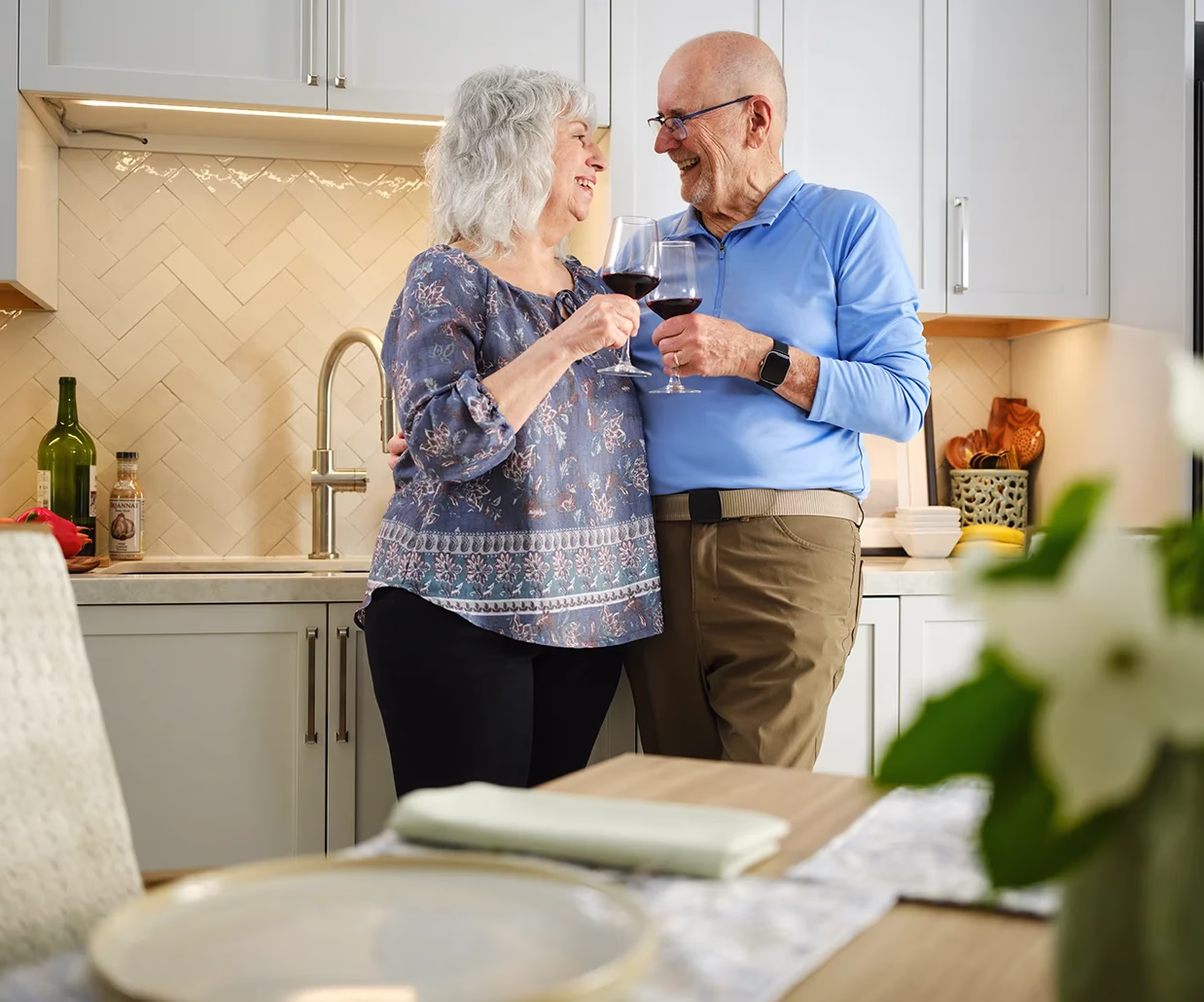 Man and woman enjoying wine in their residence