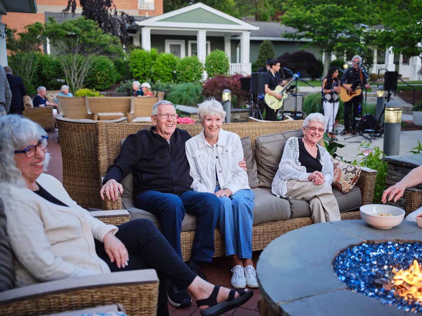 Residents enjoying entertainment on the patio