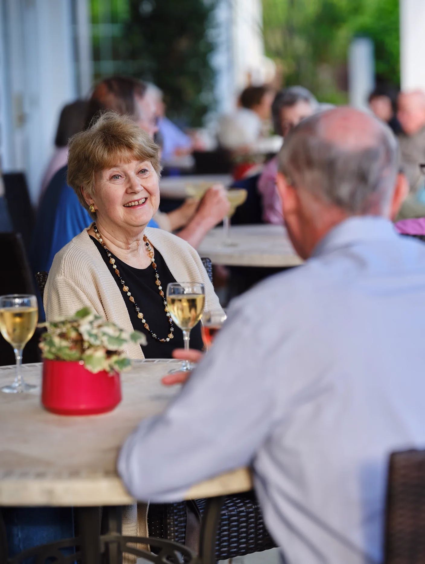 Man and woman at table on patio