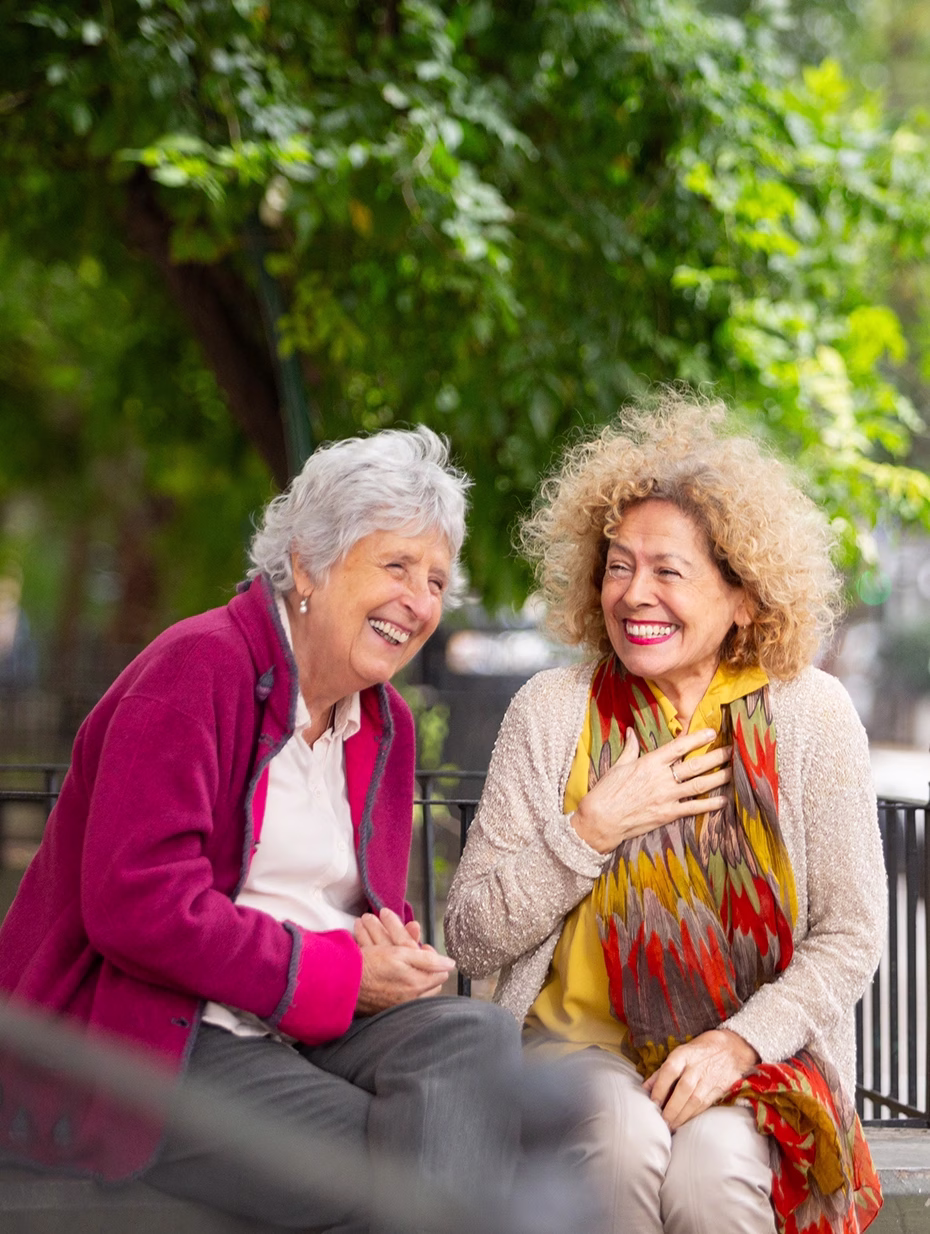 Two women outside laughing