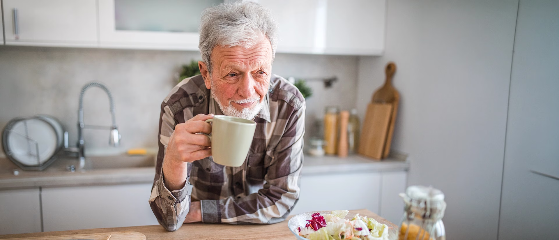 Man in kitchen with coffee